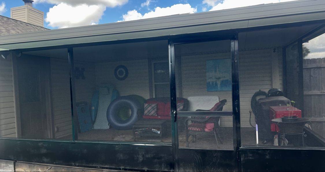 Finished rescreened patio enclosure from a side angle
